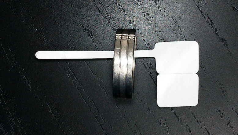 A ring on a stickDescription automatically generated